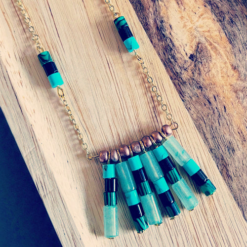 Jade, obsidian, malachite, turquoise with glass bead necklace.